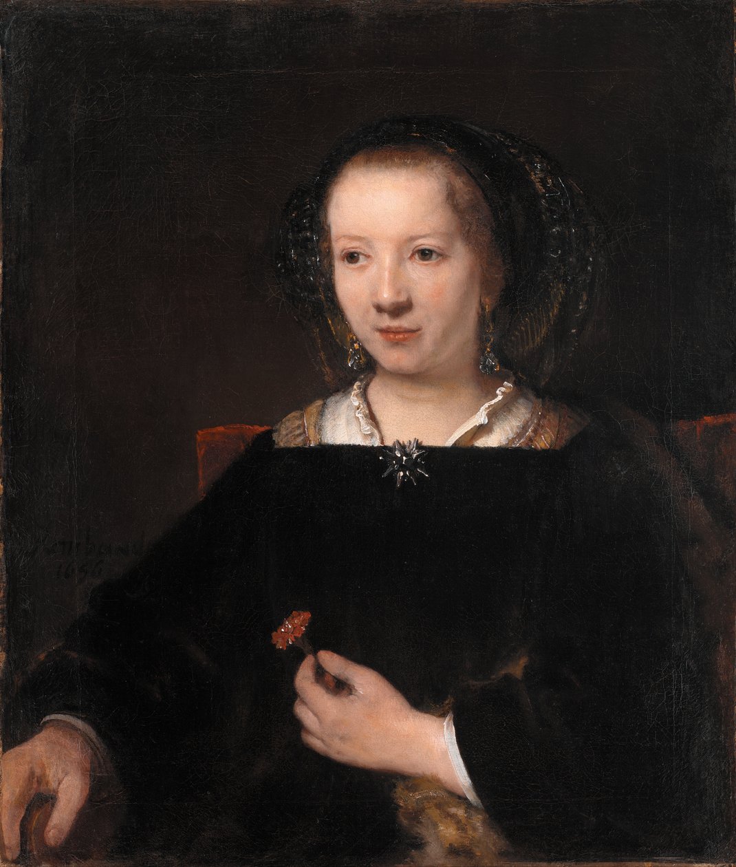 Jovem com um cravo de Workshop of Rembrandt van Rijn